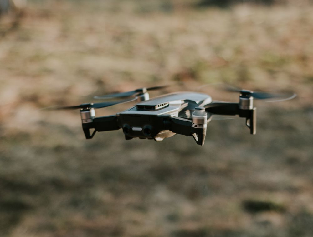 Drone flying in the sky used to take an aerial roof photo