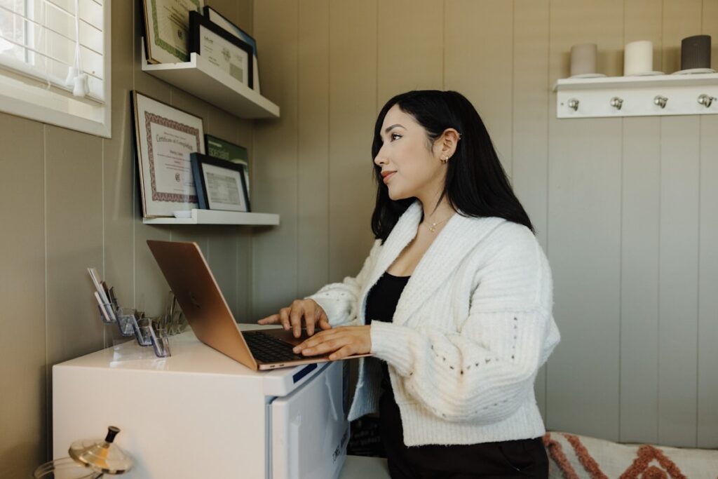 Business owner reviewing their online listing on a laptop