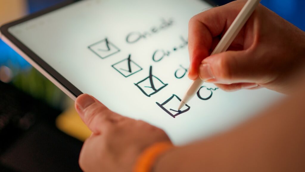 Hand marking off items on a local SEO checklist