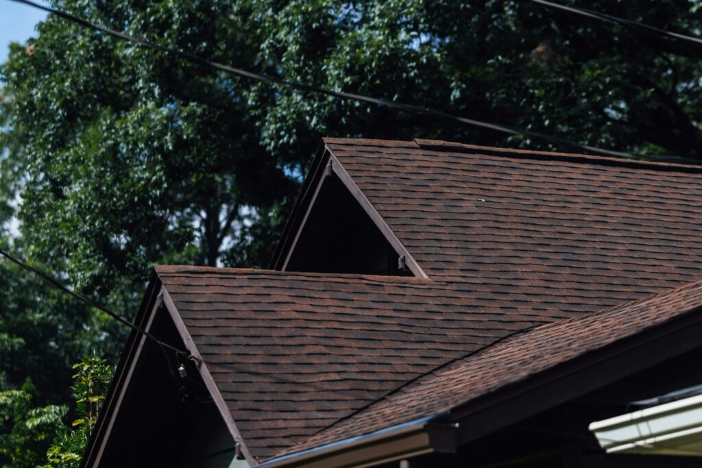 Asphalt shingle roof with trees - Google Business Profile categories for roofers