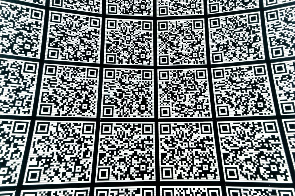 An abstract wall of QR codes, similar to one you could print and hand customers to link straight to your Google review page