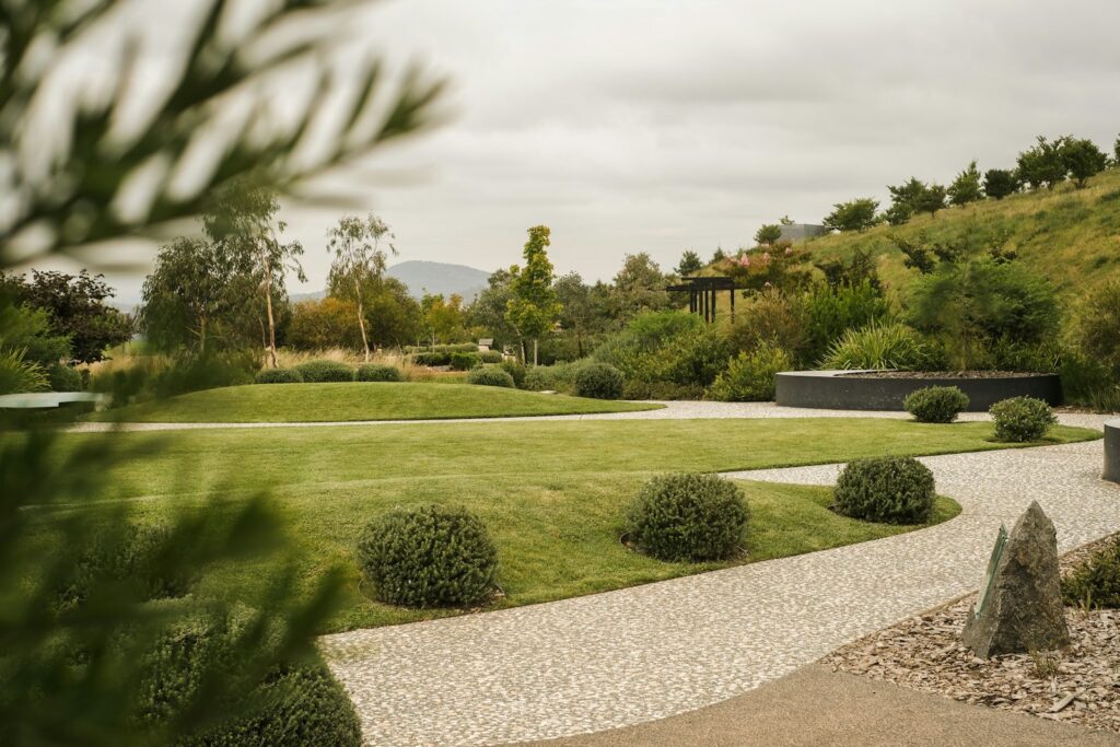 Freshly landscaped backyard with mowed lawn and garden beds